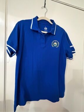 Blue Polo Shirt with White Trim and Embroidered Crest